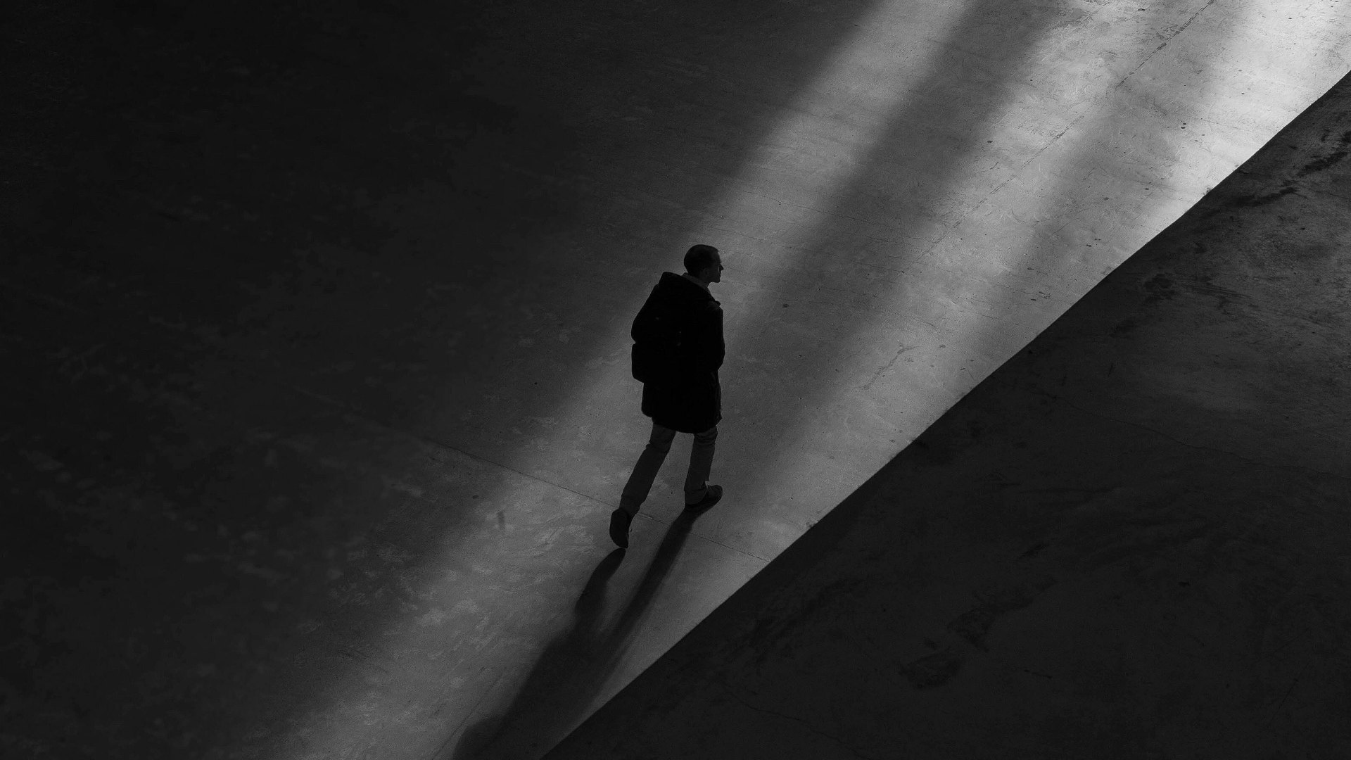 Person walking alone, carrying unexplained worry