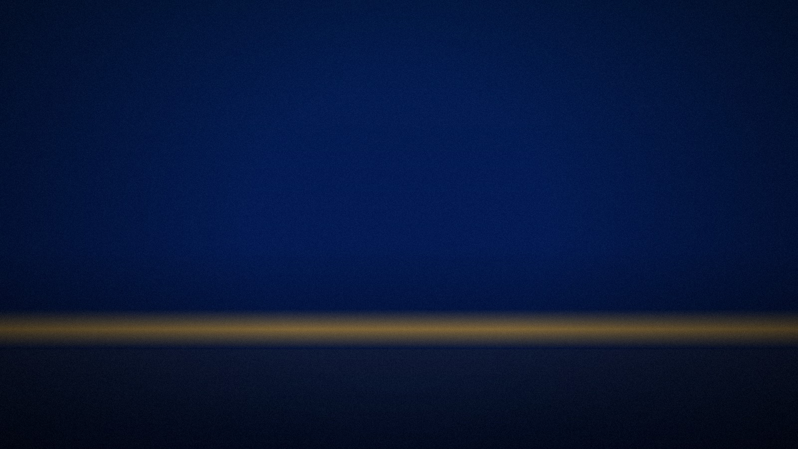 A single quiet gold horizon line in the dark, the calm after the flood