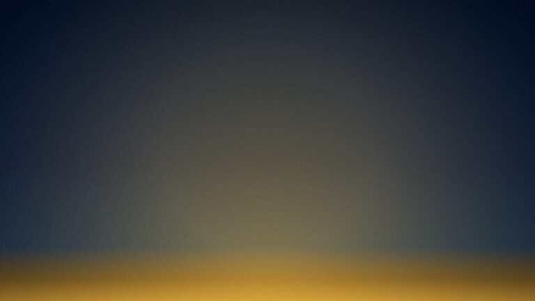 A soft gold horizon under deep navy, the quieting of a harsh inner voice